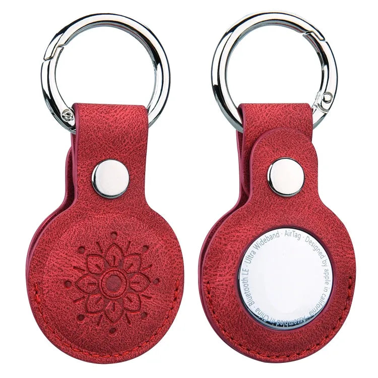 Lederen beschermhoes met bloemreliëf en sleutelhanger voor Apple AirTag (rood)